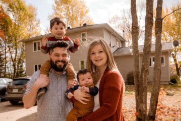 Photo of family smiling after reviewing their life insurance needs.